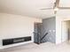 Bright living room featuring a modern fireplace and custom wall detailing leading to the upper level at 17718 Terryglass Ln, Charlotte, NC 28278