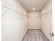 A walk-in closet featuring wire shelving on all walls and neutral carpet at 17718 Terryglass Ln, Charlotte, NC 28278