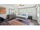 Serene bedroom with a colorful rug, a large window, and a comfortable bed at 188 Gum Branch Rd # 3, Charlotte, NC 28214