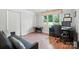 Bright bedroom with a large window overlooking the yard, featuring laminate flooring and ample closet space at 188 Gum Branch Rd # 3, Charlotte, NC 28214