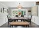 Sunlit dining room with modern decor, including bay window, pendant lighting and seating for six at 188 Gum Branch Rd # 3, Charlotte, NC 28214