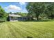 Well-maintained home with a spacious, green lawn and lush landscaping at 188 Gum Branch Rd # 3, Charlotte, NC 28214