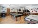 Well-lit game room with pool table, air hockey, arcade games, and bar for endless fun at 188 Gum Branch Rd # 3, Charlotte, NC 28214