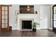 Inviting living room with a fireplace, hardwood floors, and a view to the exterior at 188 Gum Branch Rd # 3, Charlotte, NC 28214