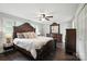 Spacious main bedroom with king size bed, dark wood floors and matching furnishings at 188 Gum Branch Rd # 3, Charlotte, NC 28214