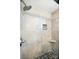 Close up of walk-in shower featuring gray tile and river rock floor at 188 Gum Branch Rd # 3, Charlotte, NC 28214