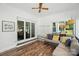 Sunroom featuring a ceiling fan, laminate flooring, a couch and sliding glass doors at 188 Gum Branch Rd # 3, Charlotte, NC 28214