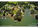 Breathtaking aerial view of waterfront property featuring mature trees and approximately 300' shoreline at 188 Ponderosa Cir, Mooresville, NC 28117