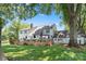 Expansive backyard with wooden deck, lush lawn, mature trees, and beautiful view of the surrounding property at 188 Ponderosa Cir, Mooresville, NC 28117