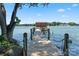 Picturesque view of a private wooden dock extending into the peaceful waters, creating a serene waterfront experience at 188 Ponderosa Cir, Mooresville, NC 28117