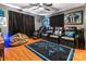 Home theater with leather recliners, ceiling fan, and fan-themed decor at 188 Ponderosa Cir, Mooresville, NC 28117