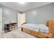 Spare bedroom featuring gray walls, laminate floors, and a convenient door to an adjacent room at 2014 Steeplechase Dr, Rock Hill, SC 29732