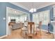 Inviting dining room, adjacent to sitting room, features hardwood floors, wainscotting, white trim, and large windows at 2014 Steeplechase Dr, Rock Hill, SC 29732