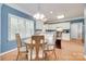 Cozy dining room with hardwood floors, white trim, modern chandelier, and large windows for plenty of natural light at 2014 Steeplechase Dr, Rock Hill, SC 29732