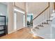 Bright foyer with hardwood floors, staircase, and a view into the adjacent living spaces at 2014 Steeplechase Dr, Rock Hill, SC 29732