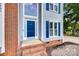 Inviting front door with sidelights and transom window, set in a brick entryway at 2014 Steeplechase Dr, Rock Hill, SC 29732