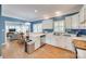 Spacious kitchen seamlessly connects to dining area and living room, featuring white cabinetry and stainless appliances at 2014 Steeplechase Dr, Rock Hill, SC 29732