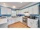 Bright kitchen features stainless appliances, white cabinets, subway tile backsplash, and hardwood floors at 2014 Steeplechase Dr, Rock Hill, SC 29732