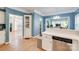 Open-concept kitchen provides easy access to multiple rooms, featuring stainless dishwasher and bright white cabinets at 2014 Steeplechase Dr, Rock Hill, SC 29732