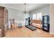Light-filled living area with hardwood floors, chandelier, and views of the yard at 2014 Steeplechase Dr, Rock Hill, SC 29732