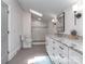 Bright bathroom with a tiled shower, granite counters, and a sleek, modern design at 202 Walden Ln, Weddington, NC 28104