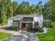 Charming two-story home with a covered front porch and manicured landscaping at 202 Walden Ln, Weddington, NC 28104