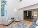 Inviting living area with high ceilings, hardwood floors, a cozy seating area, and convenient mudroom access at 202 Walden Ln, Weddington, NC 28104