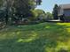 Backyard scene with a lush green lawn, landscaping, and the side of a house in the background at 204 Brentwood Dr, Maiden, NC 28650