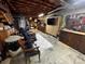 Shot of a basement area with seating, wood cabinets, and utilitarian decor at 204 Brentwood Dr, Maiden, NC 28650