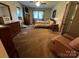 Cozy bedroom featuring a queen bed, dresser, and natural lighting at 204 Brentwood Dr, Maiden, NC 28650