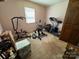 View of exercise room with treadmill, workout equipment and natural light from a window at 204 Brentwood Dr, Maiden, NC 28650