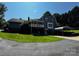 Two-story home with siding, dormer windows, porch and covered parking at 204 Brentwood Dr, Maiden, NC 28650