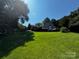 Exterior view of a home with a well-manicured lawn and surrounding trees on a sunny day at 204 Brentwood Dr, Maiden, NC 28650