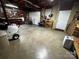 Garage scene featuring a door, tools, work areas, and ample space for storage at 204 Brentwood Dr, Maiden, NC 28650