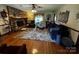 Inviting living room featuring a cozy stone fireplace, hardwood floors, and ample seating at 204 Brentwood Dr, Maiden, NC 28650