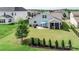 Expansive backyard with a patio, lush lawn, and black fencing at 2296 Idol Rock Dr, Indian Land, SC 29707