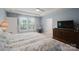 Bedroom with a large window and a tray ceiling at 2296 Idol Rock Dr, Indian Land, SC 29707