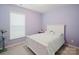 Comfortable bedroom with a large window, neutral carpet, and beautiful bright walls at 2296 Idol Rock Dr, Indian Land, SC 29707