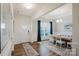 Bright dining room featuring stylish decor, modern lighting, and wood-look flooring at 2296 Idol Rock Dr, Indian Land, SC 29707