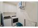 Bright laundry room featuring a modern washer and dryer, cabinets and storage at 2296 Idol Rock Dr, Indian Land, SC 29707