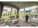 Relaxing screened-in porch with comfortable seating and view of the landscaped backyard at 2296 Idol Rock Dr, Indian Land, SC 29707