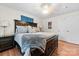 Spacious main bedroom with a large bed, wood flooring, neutral colors, and natural light at 24253 Old Aquadale Rd, Albemarle, NC 28001