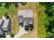Overhead view of a house with a long driveway and well-kept lawn, surrounded by trees at 2525 Surveyor General Dr, Waxhaw, NC 28173
