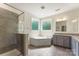 Bathroom with a walk-in shower, granite countertops, and separate tub at 2525 Surveyor General Dr, Waxhaw, NC 28173