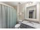 Cozy bathroom with a shower and a granite countertop vanity with a sink, plus a linen closet at 2525 Surveyor General Dr, Waxhaw, NC 28173