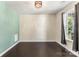 Bright bedroom with hardwood floors, a modern light fixture, and large windows at 2525 Surveyor General Dr, Waxhaw, NC 28173