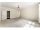 Spacious carpeted bedroom with modern light fixture and neutral paint at 2525 Surveyor General Dr, Waxhaw, NC 28173
