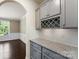 Butler's pantry featuring granite countertop, wine rack, and view to dining room at 2525 Surveyor General Dr, Waxhaw, NC 28173