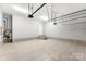 Spacious garage featuring tile flooring and ample space for parking and storage at 2525 Surveyor General Dr, Waxhaw, NC 28173