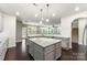 Kitchen featuring a large island, stainless steel appliances, and lots of natural light at 2525 Surveyor General Dr, Waxhaw, NC 28173